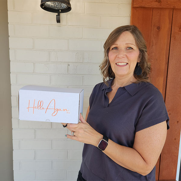 Tina, holding Hello Again Box