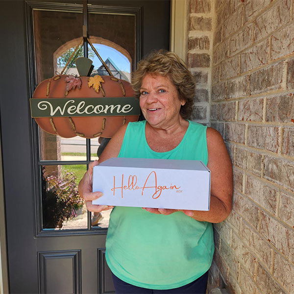 Shari, holding Hello Again Box